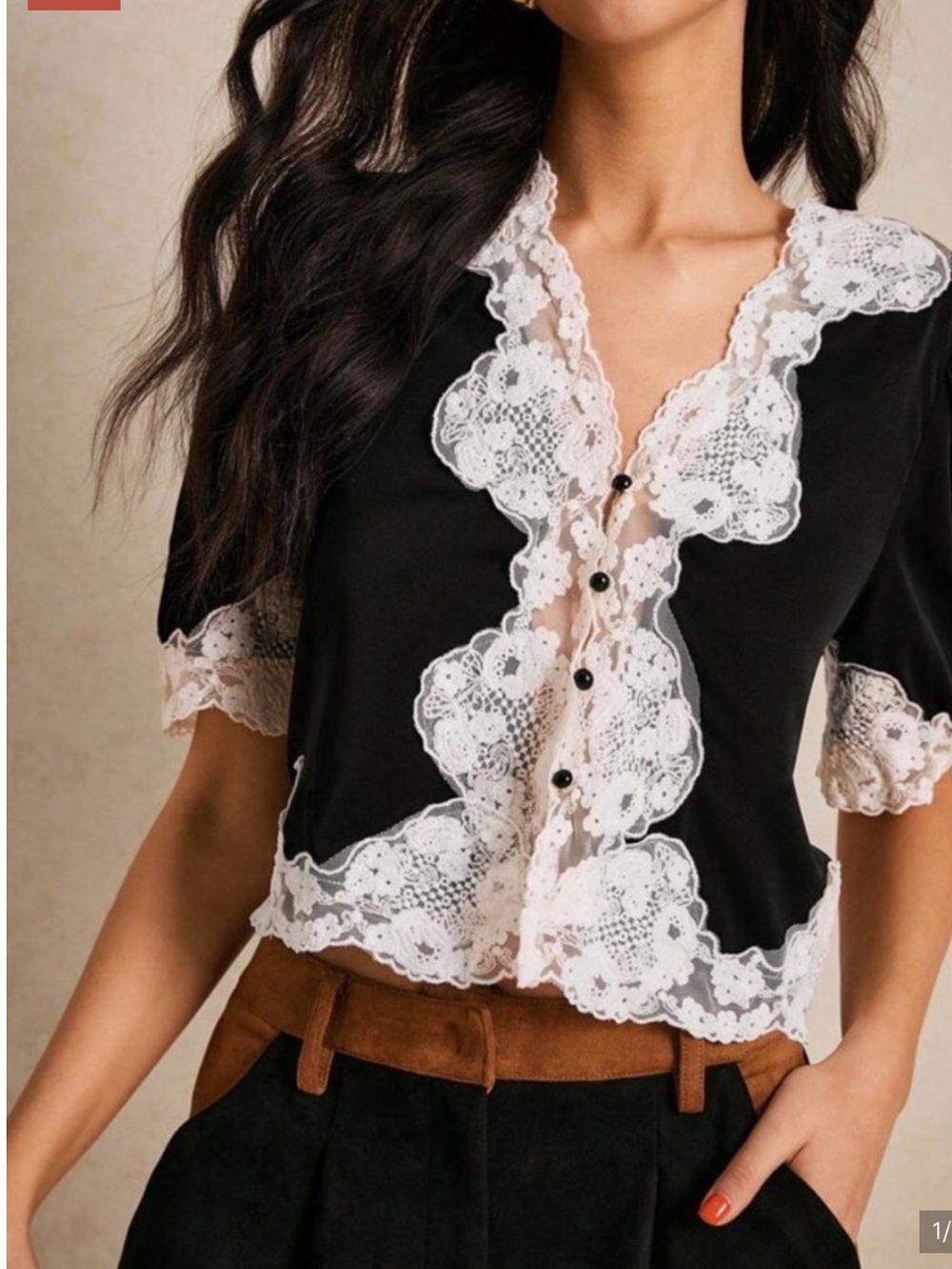 Black top with white lace trim.